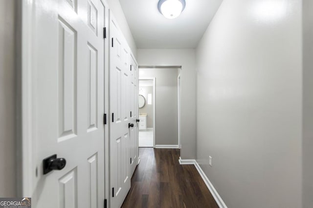 corridor featuring dark hardwood / wood-style floors