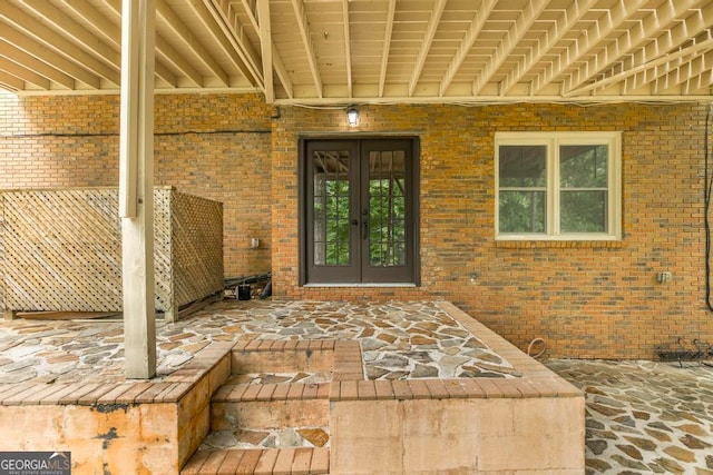 property entrance with french doors and a patio area