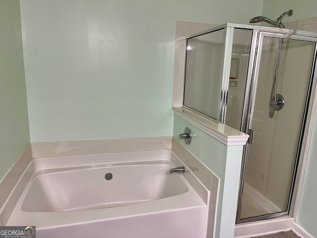 bathroom featuring plus walk in shower