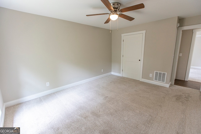 unfurnished bedroom featuring ceiling fan and carpet floors