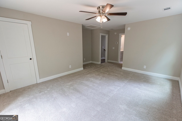 interior space featuring light colored carpet and ceiling fan