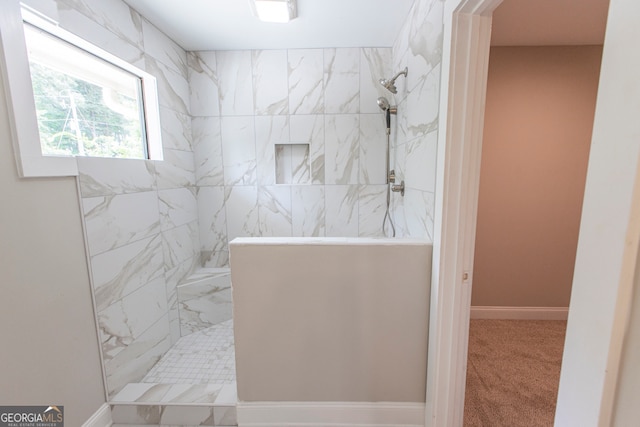 bathroom with tiled shower