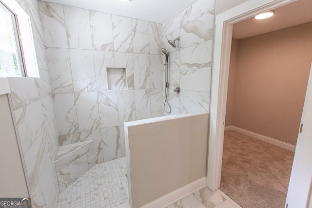 bathroom featuring a tile shower