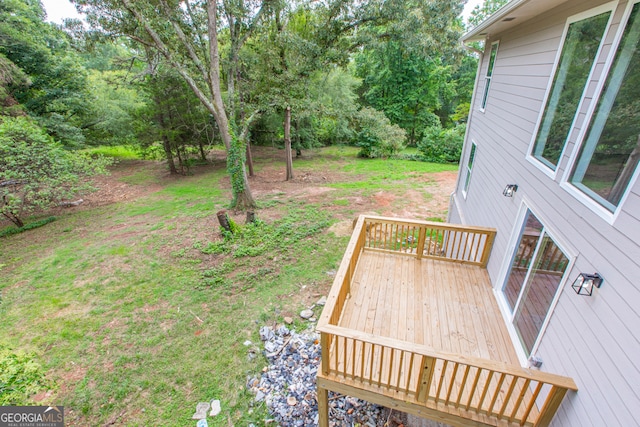 deck featuring a yard