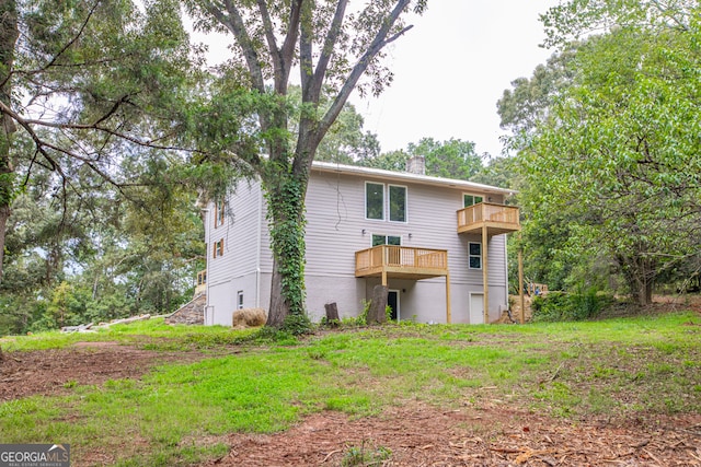 back of property featuring a balcony