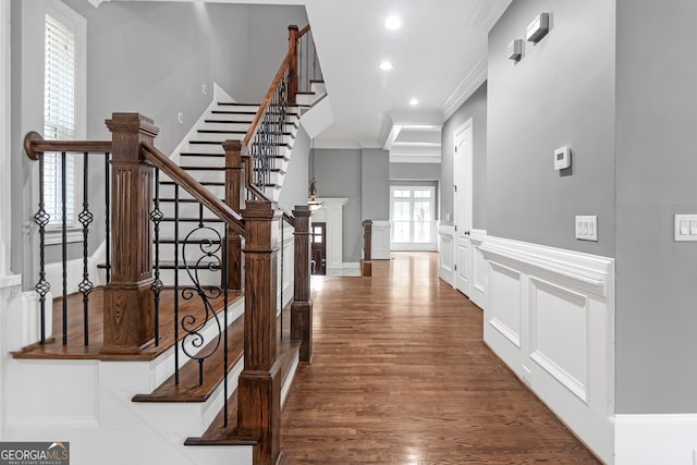 interior space with crown molding and hardwood / wood-style flooring