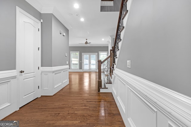 corridor featuring crown molding and dark hardwood / wood-style flooring