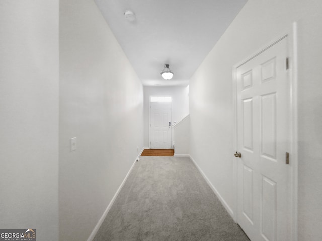 hallway with light carpet