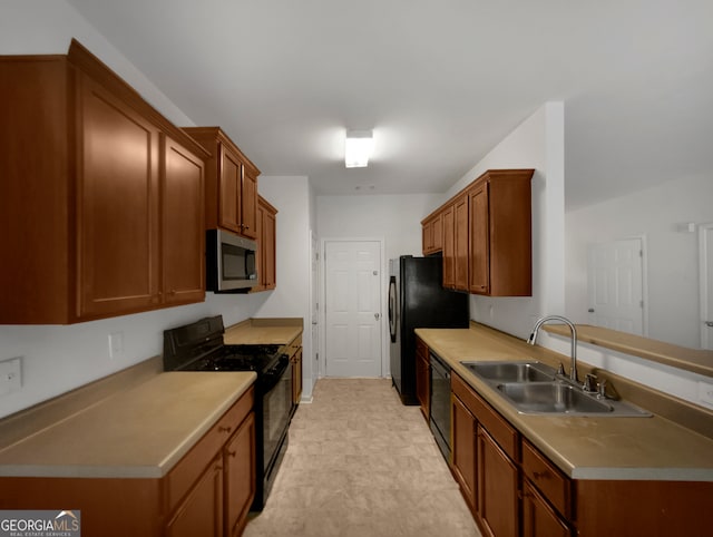 kitchen with black appliances and sink