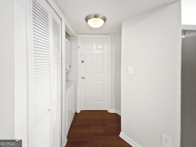 200 Renaissance Pkwy NE Apt 302, Atlanta, GA 30308 - hall featuring stacked washing machine and dryer and dark wood-style flooring