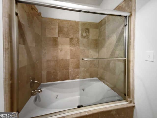 bathroom featuring shower / bath combination with glass door