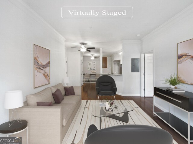 living room with ceiling fan, ornamental molding, and wood-type flooring