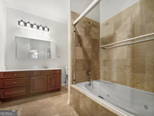 full bathroom with toilet, a combined bath / shower with jetted tub, and vanity