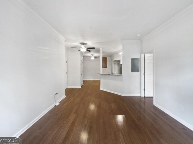 200 Renaissance Pkwy NE Apt 302, Atlanta, GA 30308 - unfurnished living room with a ceiling fan, crown molding, electric panel, and dark wood-type flooring