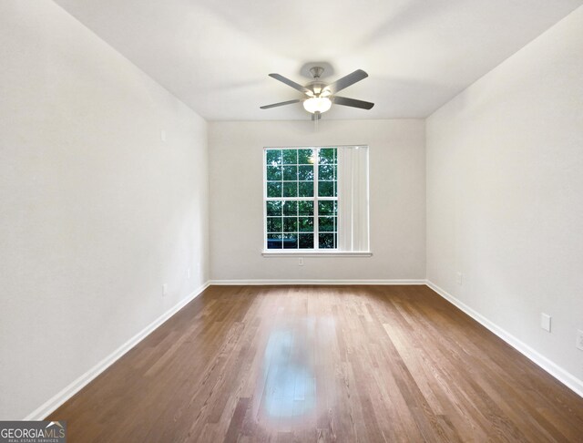 200 Renaissance Pkwy NE Apt 302, Atlanta, GA 30308 - empty room featuring wood finished floors and ceiling fan