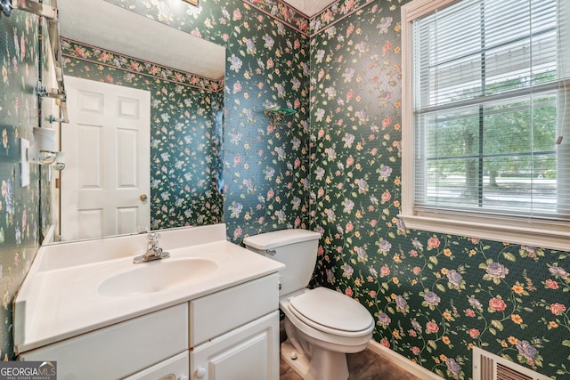 bathroom featuring vanity and toilet