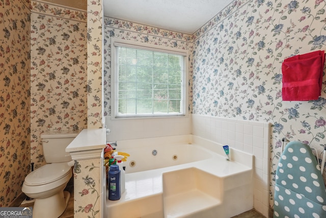 bathroom with toilet and a washtub