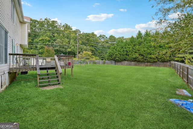 view of yard featuring a wooden deck