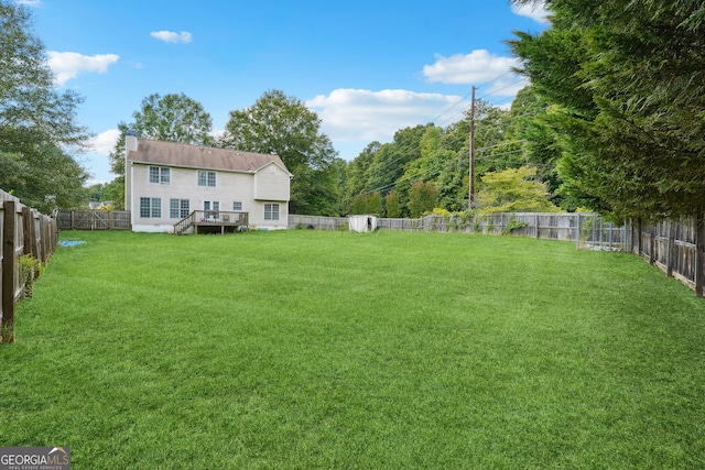 view of yard featuring a deck