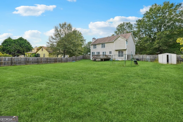 view of yard featuring a storage unit