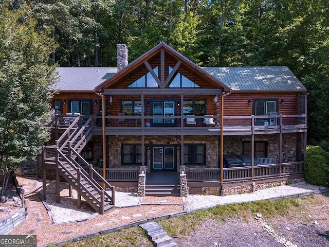 rear view of property with a balcony