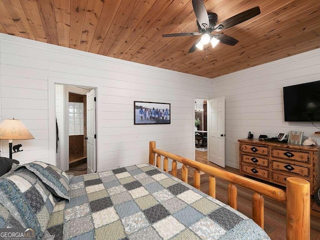 bedroom with ensuite bath, wood walls, ceiling fan, and wooden ceiling