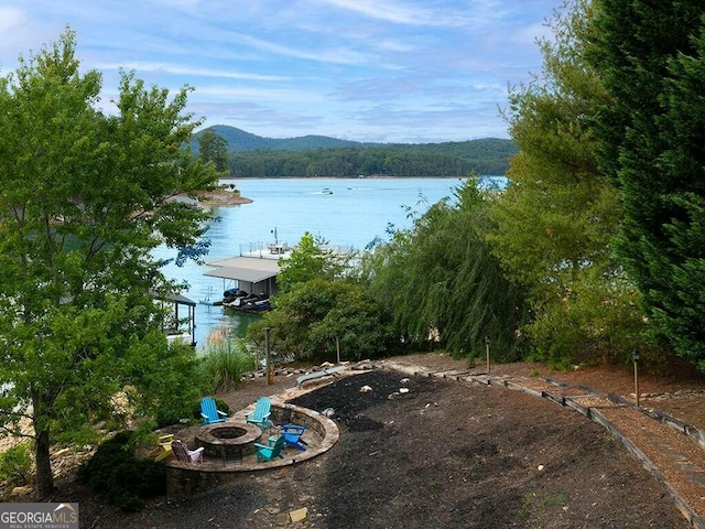 view of water feature featuring an outdoor fire pit