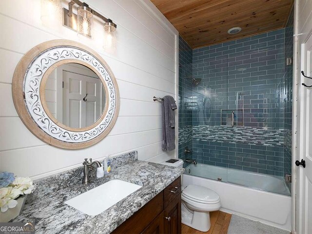 full bathroom with toilet, shower / bath combination with glass door, vanity, wood-type flooring, and wood ceiling