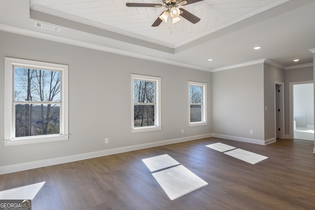 unfurnished room with crown molding, plenty of natural light, dark hardwood / wood-style floors, and ceiling fan