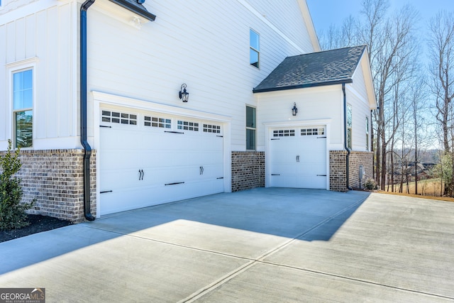 view of side of home featuring a garage