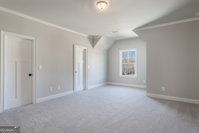 bonus room featuring vaulted ceiling and light carpet