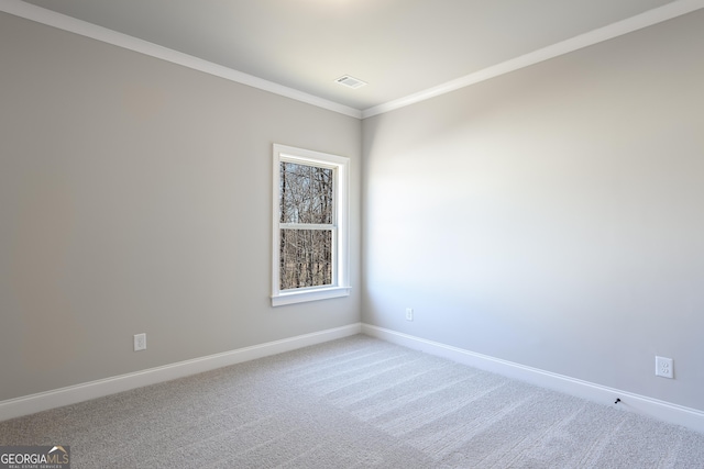 carpeted empty room with ornamental molding