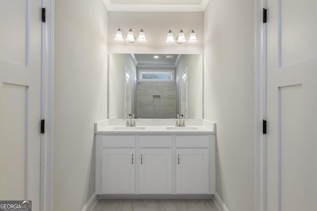 bathroom with walk in shower, vanity, and crown molding