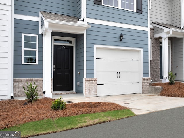 property entrance with a garage