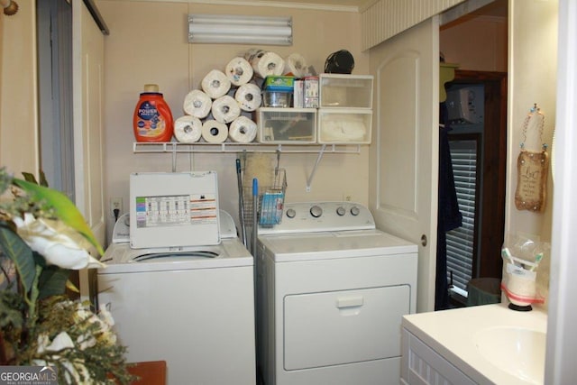 laundry area with crown molding and independent washer and dryer