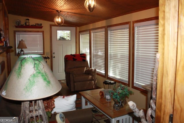 living area with lofted ceiling and wood ceiling