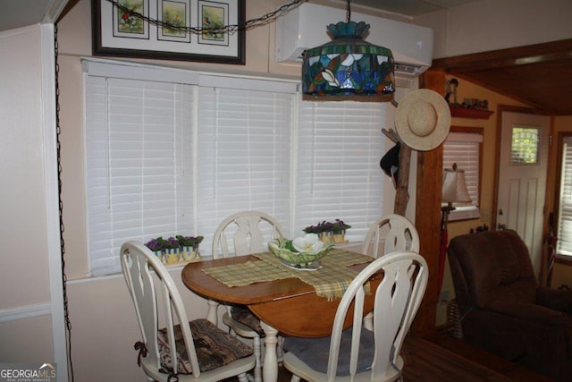 dining area featuring hardwood / wood-style flooring and a healthy amount of sunlight