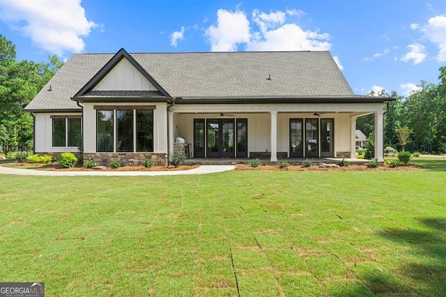 rear view of property with a yard and french doors