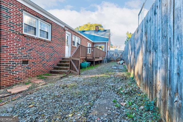 view of yard featuring a wooden deck