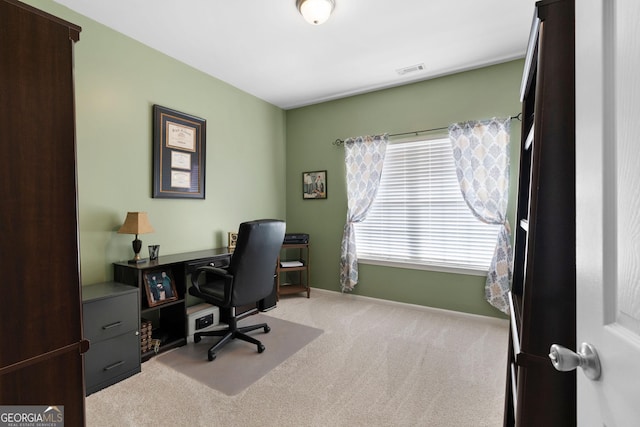 office featuring visible vents, carpet floors, and baseboards