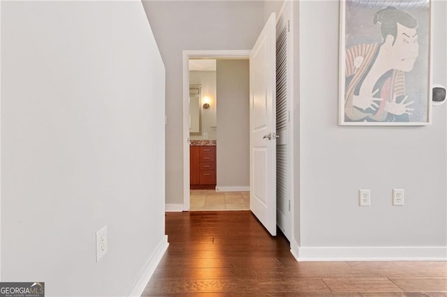 corridor featuring dark hardwood / wood-style flooring