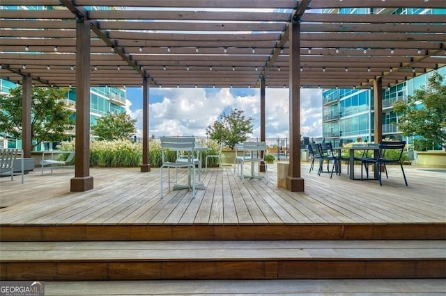 wooden terrace featuring a pergola