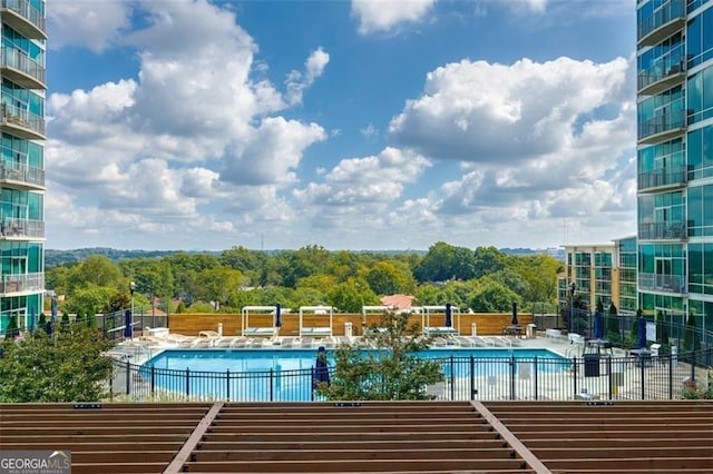 view of swimming pool featuring a patio