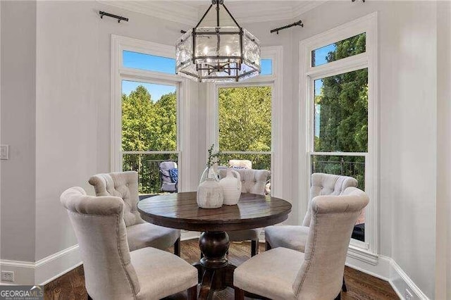 dining area with a notable chandelier and dark hardwood / wood-style floors