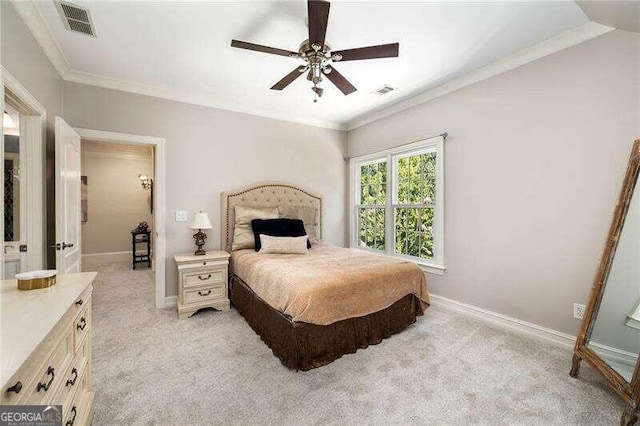 bedroom with ceiling fan, light carpet, and ornamental molding