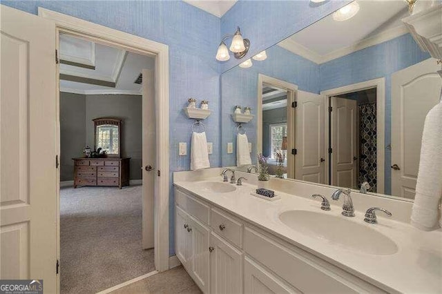 bathroom featuring a healthy amount of sunlight, crown molding, and vanity