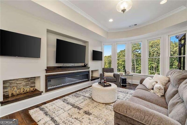 living room featuring ornamental molding and wood-type flooring