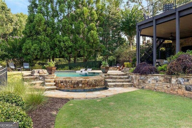 view of yard with a fenced in pool