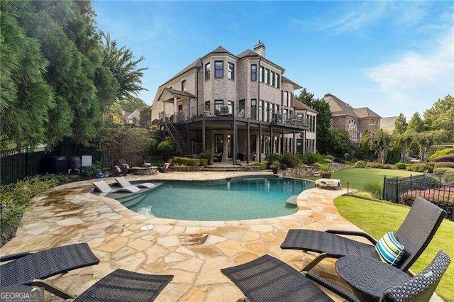 view of pool featuring a patio area and a lawn