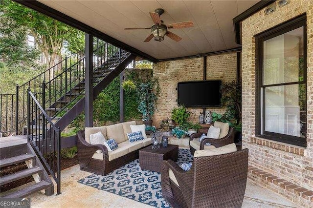 view of patio / terrace with an outdoor living space and ceiling fan